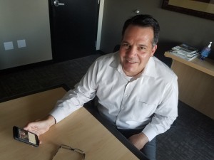 Richard Lozano, a criminal defense attorney in St. Louis, says the Monikur app he created enables attorneys to control their availability by cellphone. It also helps to organize texts for billing purposes. Photo by Nicholas Phillips.