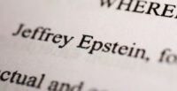 Newly-released documents from disgraced late financier and sex offender Jeffrey Epstein, referencing court cases against him, are seen in this handout released by the U.S. Justice Department and printed and arranged for a photograph by Reuters in Washington, D.C., U.S., December 19, 2025. REUTERS/Jonathan Ernst/File Photo