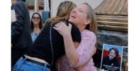 Amy Neville, mother of Alexander, is embraced outside a courtroom in Los Angeles