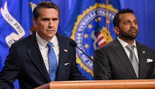 Todd Blanche speaks as FBI Director Kash Patel stands by his side during a press conference