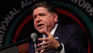 JB Pritzker speaks during a conference