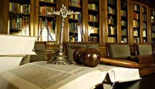 Scales of justice, law book, gavel