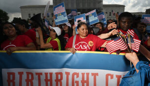People demonstrate with the immigrant rights’ organization CASA outside the Supreme Court in May
