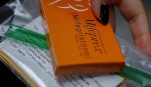 A staff member at Alamo Women's Clinic prepares Mifepristone, the first pill in a medical abortion
