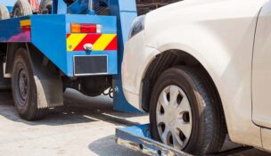 A tow truck lifting a car