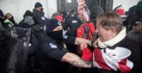 Members of law enforcement clash with pro-Trump protesters at the U.S. Capitol Building in Washington, D.C., on Jan. 6, 2021.