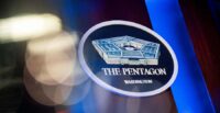 The Pentagon logo is seen behind the podium in the briefing room at the Pentagon
