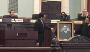 Judge Christian Stevens (left) stands with Judge John P. Torbitzky (right) as they unveil Stevens’ portrait on June 9. Photo by Kallie Cox.