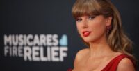 Taylor Swift poses on the red carpet at the Grammy Awards